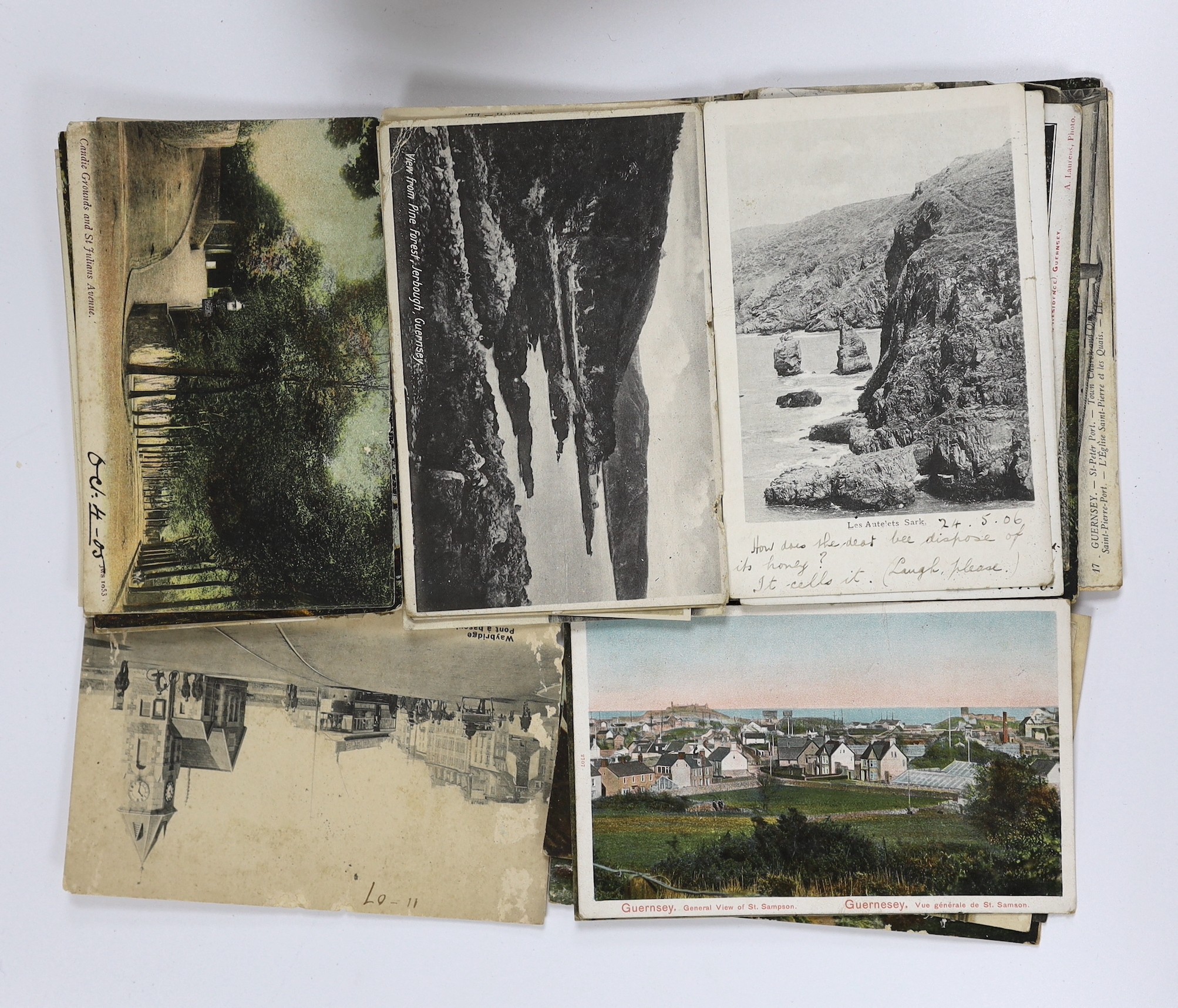 A collection of Edwardian and later topographical postcards, loose and in booklets